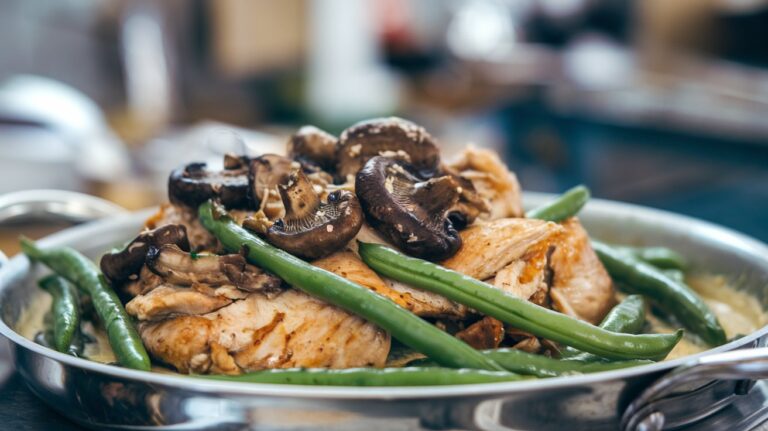 One Skillet Chicken with Green Beans and Mushrooms Garnished with Fresh Herbs" A delicious one-skillet chicken dish garnished with fresh herbs, showcasing tender chicken, green beans, and mushrooms cooked to perfection, making for an easy and flavorful weeknight dinner.